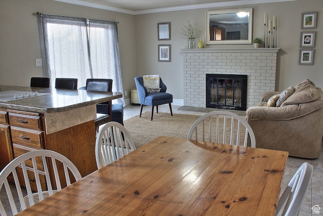 715 W 1600 N, Mapleton, UT 84664 - dining area with crown molding, a brick fireplace, and light tile patterned floors