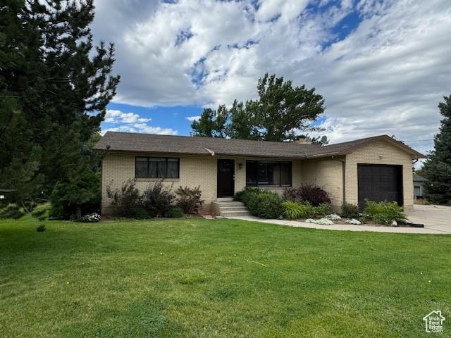 715 W 1600 N, Mapleton, UT 84664 - single story home with a garage, brick siding, a front lawn, and driveway