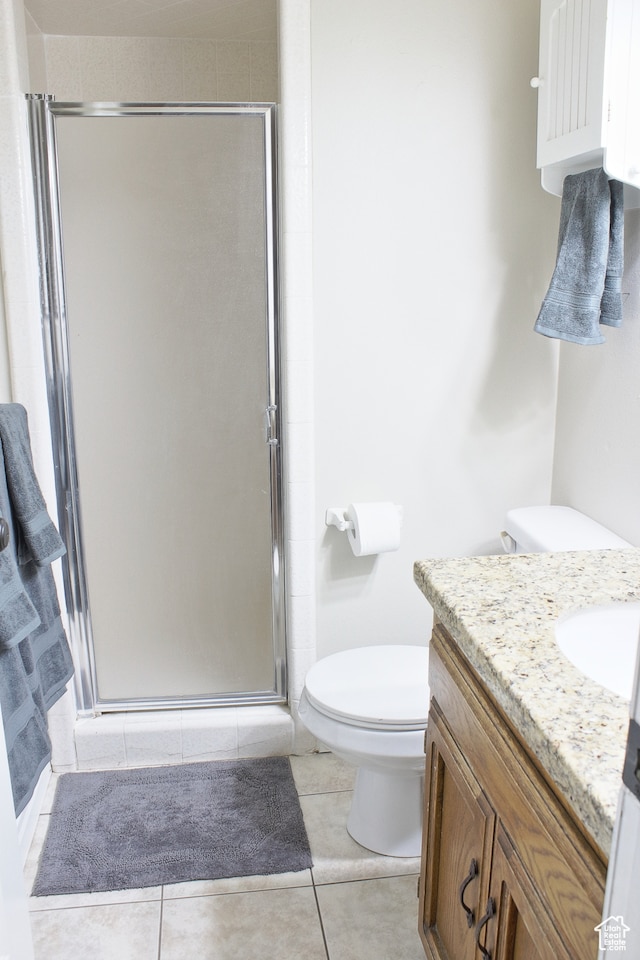 715 W 1600 N, Mapleton, UT 84664 - bathroom featuring toilet, vanity, a shower stall, and tile patterned flooring