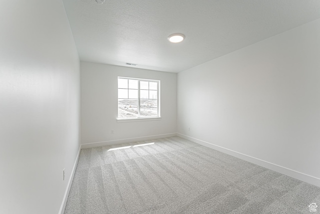 652 W Salvia Dr Unit 2144, Saratoga Springs, UT 84045 - empty room featuring carpet flooring, baseboards, and a textured ceiling