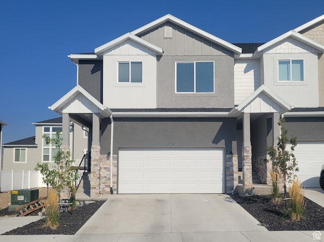 724 N 160 E, Tooele, UT 84074 - craftsman-style home featuring cooling unit, a garage, board and batten siding, and stone siding