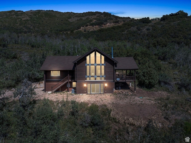 5404 Mountain Vw, Kamas, UT 84036 - back of house featuring a mountain view, stairs, log veneer siding, and a wooded view