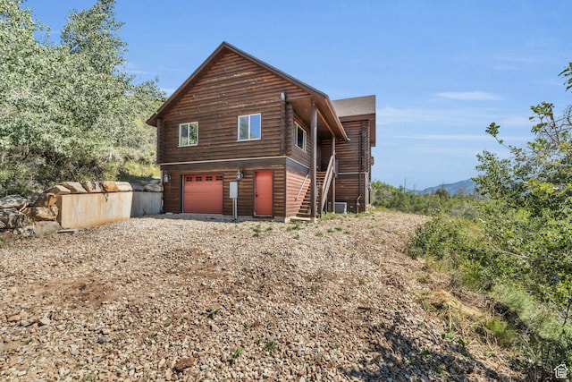 5404 Mountain Vw, Kamas, UT 84036 - view of home's exterior with central AC, stairway, and an attached garage