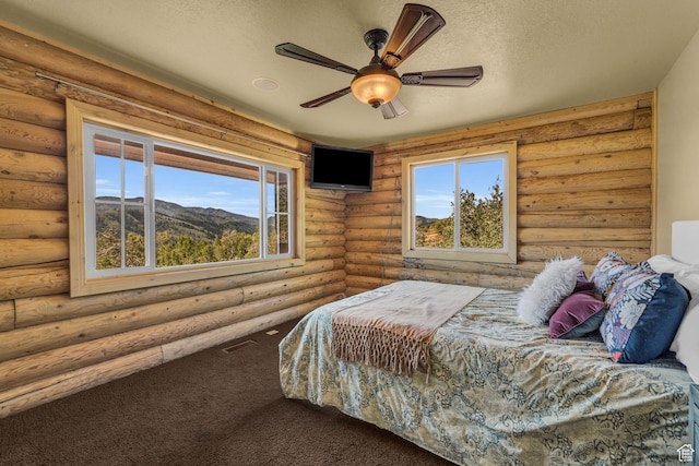 5404 Mountain Vw, Kamas, UT 84036 - bedroom featuring a textured ceiling, visible vents, multiple windows, and carpet