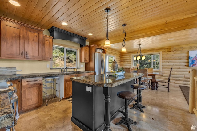 5404 Mountain Vw, Kamas, UT 84036 - kitchen with stainless steel appliances, brown cabinetry, wood ceiling, and a center island