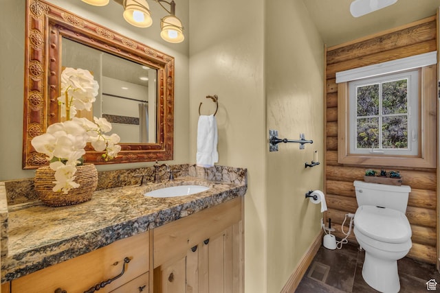 5404 Mountain Vw, Kamas, UT 84036 - full bathroom with visible vents, baseboards, toilet, vanity, and rustic walls