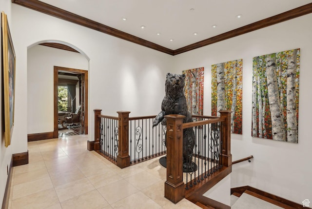 340 Hollyhock St, Park City, UT 84098 - hall featuring ornamental molding, an upstairs landing, arched walkways, light tile patterned floors, and baseboards