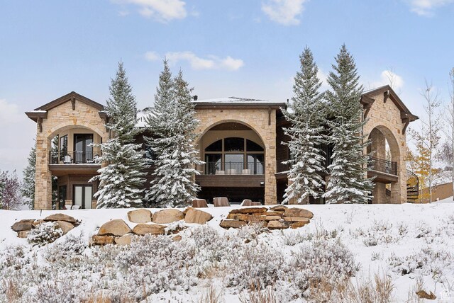 340 Hollyhock St, Park City, UT 84098 - view of front facade featuring french doors, stone siding, and a balcony