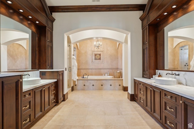340 Hollyhock St, Park City, UT 84098 - full bathroom featuring baseboards, a garden tub, two vanities, and a sink
