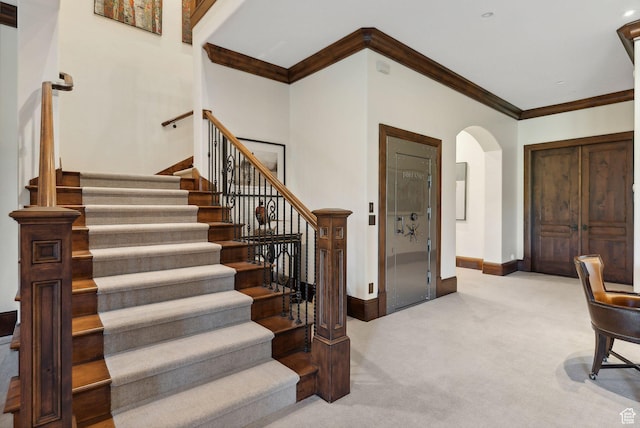 340 Hollyhock St, Park City, UT 84098 - stairway featuring arched walkways, ornamental molding, carpet, and baseboards