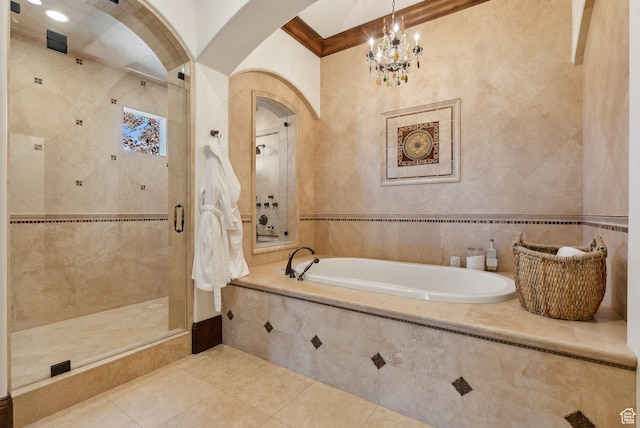 340 Hollyhock St, Park City, UT 84098 - full bath featuring a bath, tile patterned flooring, a stall shower, and a notable chandelier