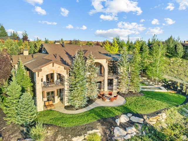 340 Hollyhock St, Park City, UT 84098 - back of property featuring a balcony, a yard, french doors, a patio, and stone siding