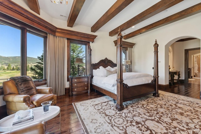 340 Hollyhock St, Park City, UT 84098 - bedroom with wood-type flooring, visible vents, baseboards, beamed ceiling, and arched walkways