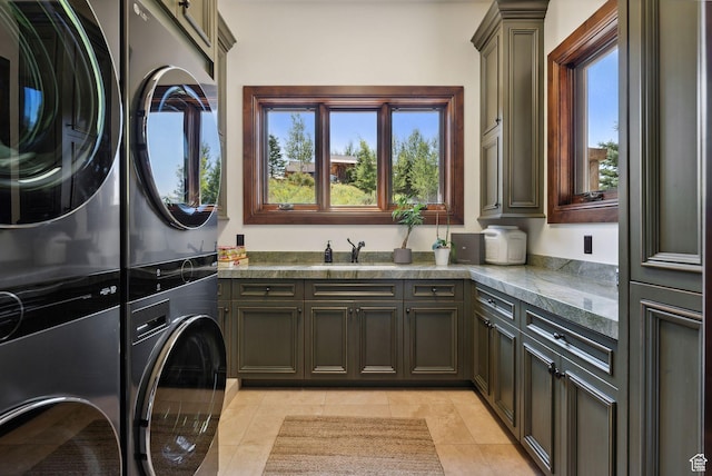 340 Hollyhock St, Park City, UT 84098 - laundry room with light tile patterned floors, a sink, stacked washer / dryer, and cabinet space