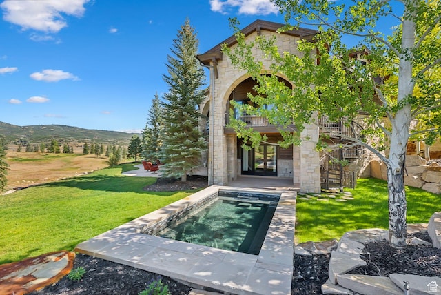 340 Hollyhock St, Park City, UT 84098 - exterior space featuring a yard, a balcony, french doors, a patio, and stone siding