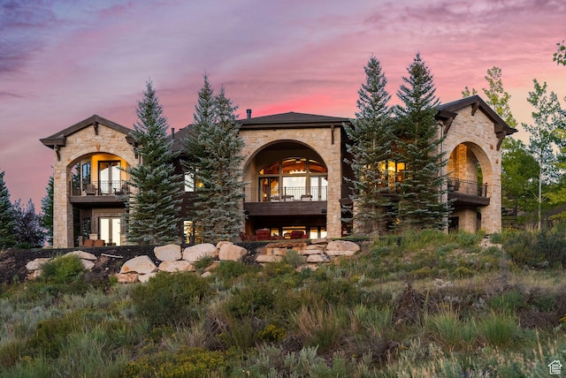 340 Hollyhock St, Park City, UT 84098 - mediterranean / spanish house featuring a balcony, stone siding, and french doors