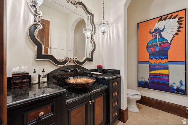 340 Hollyhock St, Park City, UT 84098 - half bath featuring tile patterned flooring, toilet, a notable chandelier, and vanity