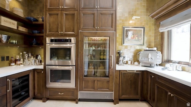 340 Hollyhock St, Park City, UT 84098 - bar with beverage cooler, stainless steel double oven, tasteful backsplash, and fridge