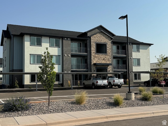 553 S 100 W Unit 203, Richfield, UT 84701 - view of building exterior with covered and uncovered parking
