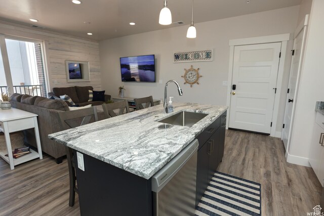 553 S 100 W Unit 203, Richfield, UT 84701 - kitchen featuring stainless steel dishwasher, dark wood-style floors, recessed lighting, pendant lighting, and a center island with sink