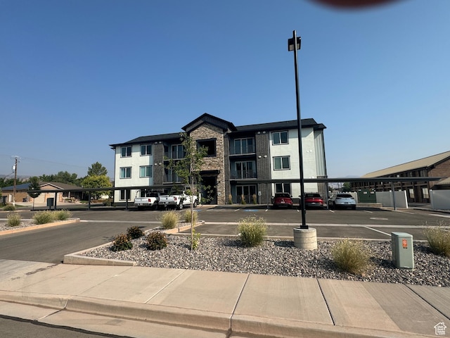 553 S 100 W Unit 203, Richfield, UT 84701 - view of building exterior with covered and uncovered parking