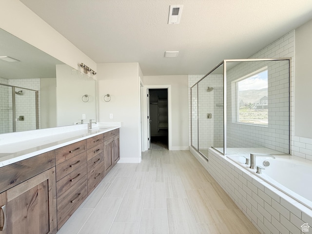 1546 S Lukas Ln, Saratoga Springs, UT 84045 - bathroom featuring a stall shower, double vanity, a bath, and a walk in closet