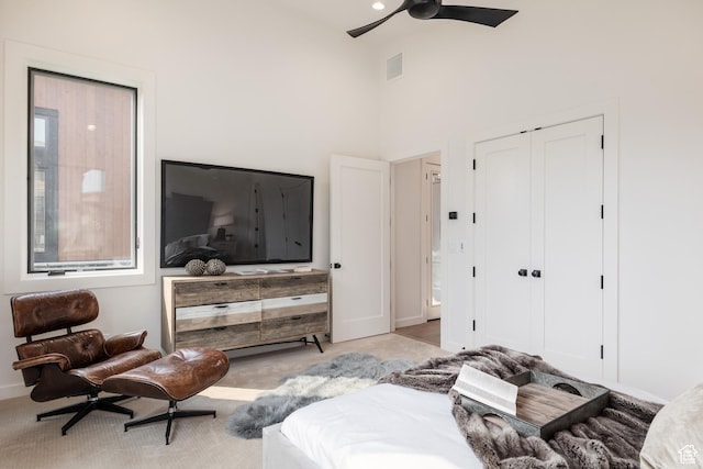 bedroom with a closet, visible vents, and a ceiling fan