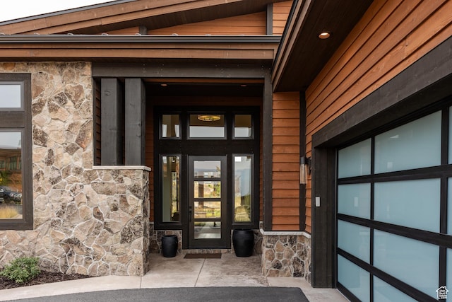 doorway to property with stone siding