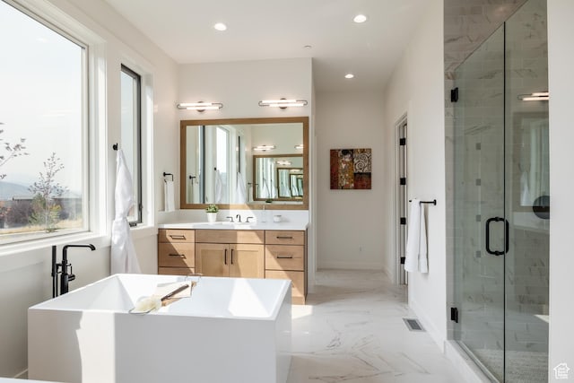 bathroom featuring vanity, recessed lighting, a soaking tub, marble finish floor, and a stall shower