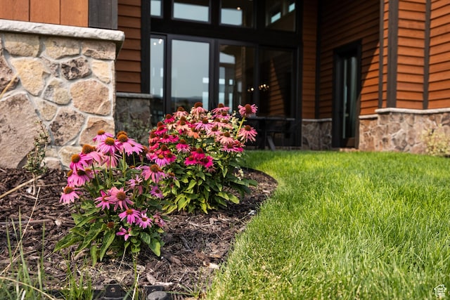 exterior space with stone siding
