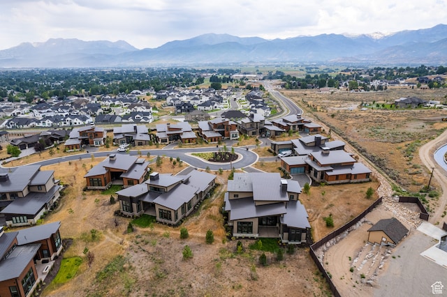 birds eye view of property featuring a mountain view