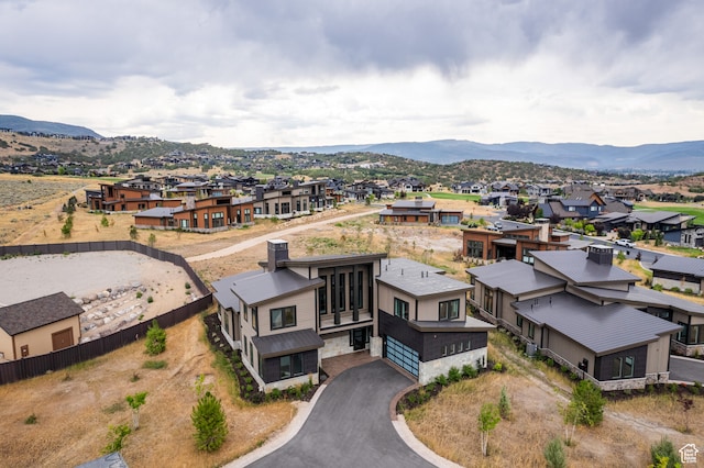 drone / aerial view featuring a mountain view