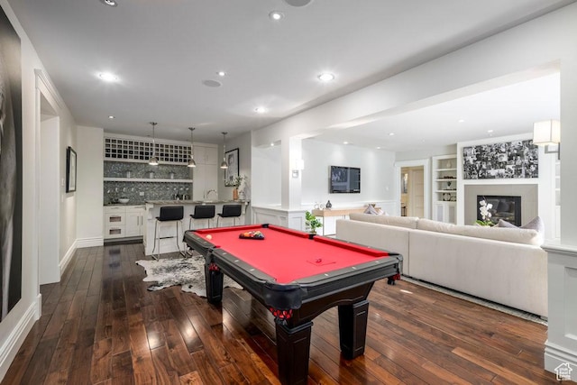 rec room featuring recessed lighting, wet bar, pool table, and dark wood-type flooring