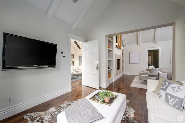 living area with vaulted ceiling with beams, baseboards, and wood finished floors