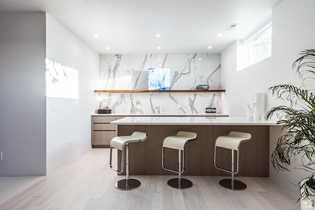 405 N Virginia St, Salt Lake City, UT 84103 - bar featuring recessed lighting, light wood-style floors, and backsplash