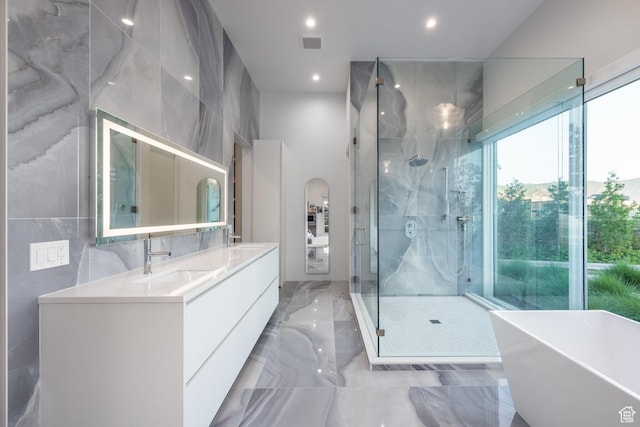 405 N Virginia St, Salt Lake City, UT 84103 - bathroom featuring visible vents, a freestanding bath, double vanity, a stall shower, and a sink