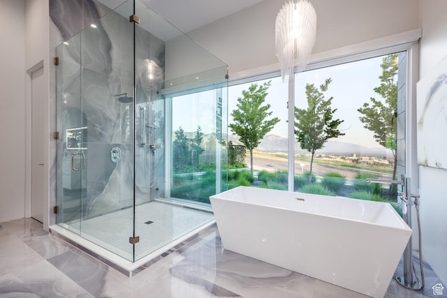 405 N Virginia St, Salt Lake City, UT 84103 - bathroom with a soaking tub, marble finish floor, and a shower stall