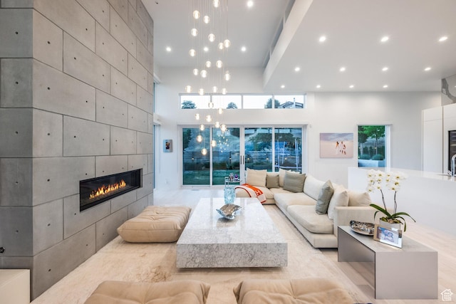 405 N Virginia St, Salt Lake City, UT 84103 - living area featuring recessed lighting, a high ceiling, and a tile fireplace