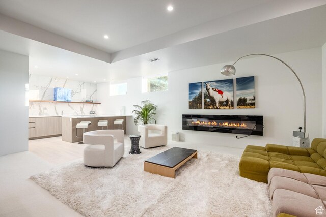 405 N Virginia St, Salt Lake City, UT 84103 - living room featuring a glass covered fireplace, recessed lighting, and visible vents