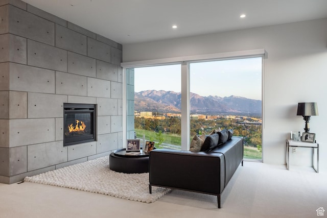 405 N Virginia St, Salt Lake City, UT 84103 - carpeted living area with recessed lighting, a mountain view, and a fireplace
