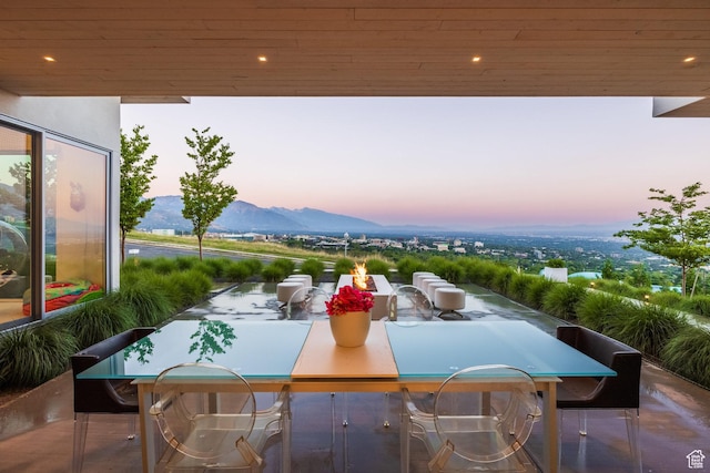 405 N Virginia St, Salt Lake City, UT 84103 - patio terrace at dusk with outdoor dining area and a mountain view