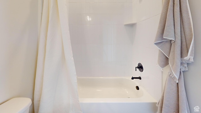 full bath featuring shower / tub combo and toilet