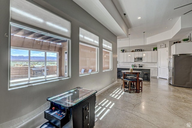 3243 S 4900 W, Hurricane, UT 84737 - dining area featuring baseboards, finished concrete flooring, and recessed lighting