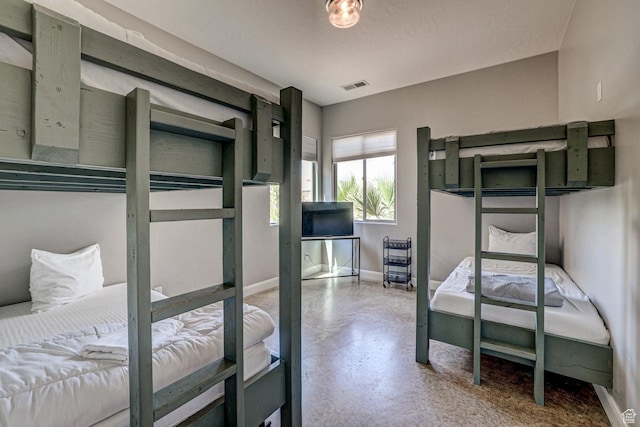 3243 S 4900 W, Hurricane, UT 84737 - bedroom featuring baseboards, concrete floors, and visible vents