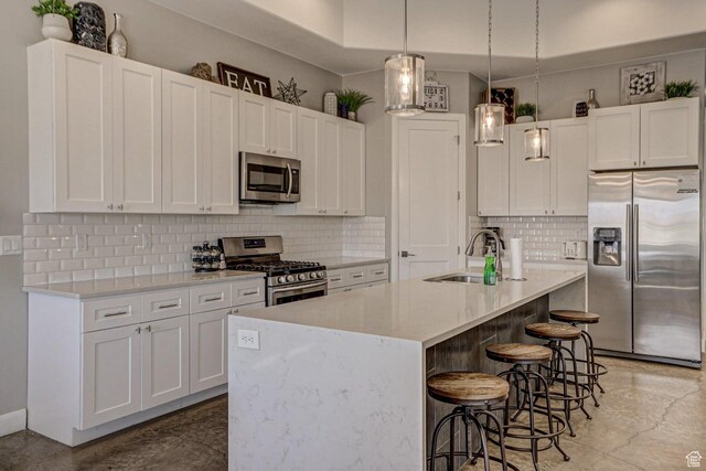 3243 S 4900 W, Hurricane, UT 84737 - kitchen with white cabinetry, a sink, and appliances with stainless steel finishes
