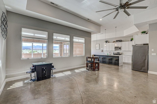 3243 S 4900 W, Hurricane, UT 84737 - living room featuring visible vents, baseboards, concrete floors, ceiling fan, and recessed lighting