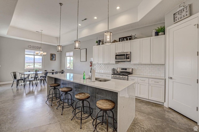 3243 S 4900 W, Hurricane, UT 84737 - kitchen with a sink, a raised ceiling, tasteful backsplash, stainless steel appliances, and white cabinets