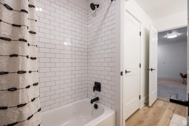 608 E Simpson Ave S, Salt Lake City, UT 84106 - bathroom featuring shower / tub combo, wood finished floors, and baseboards