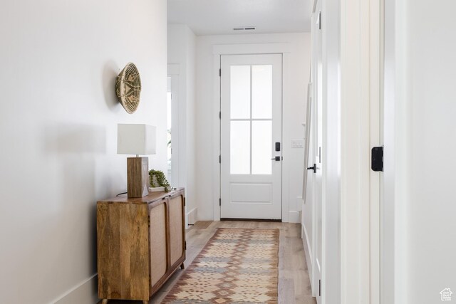 608 E Simpson Ave S, Salt Lake City, UT 84106 - doorway to outside with light wood-type flooring and visible vents