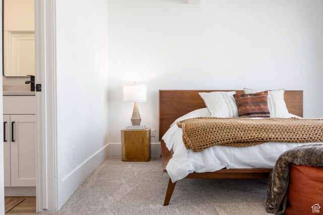 608 E Simpson Ave S, Salt Lake City, UT 84106 - bedroom with carpet floors, a sink, and baseboards